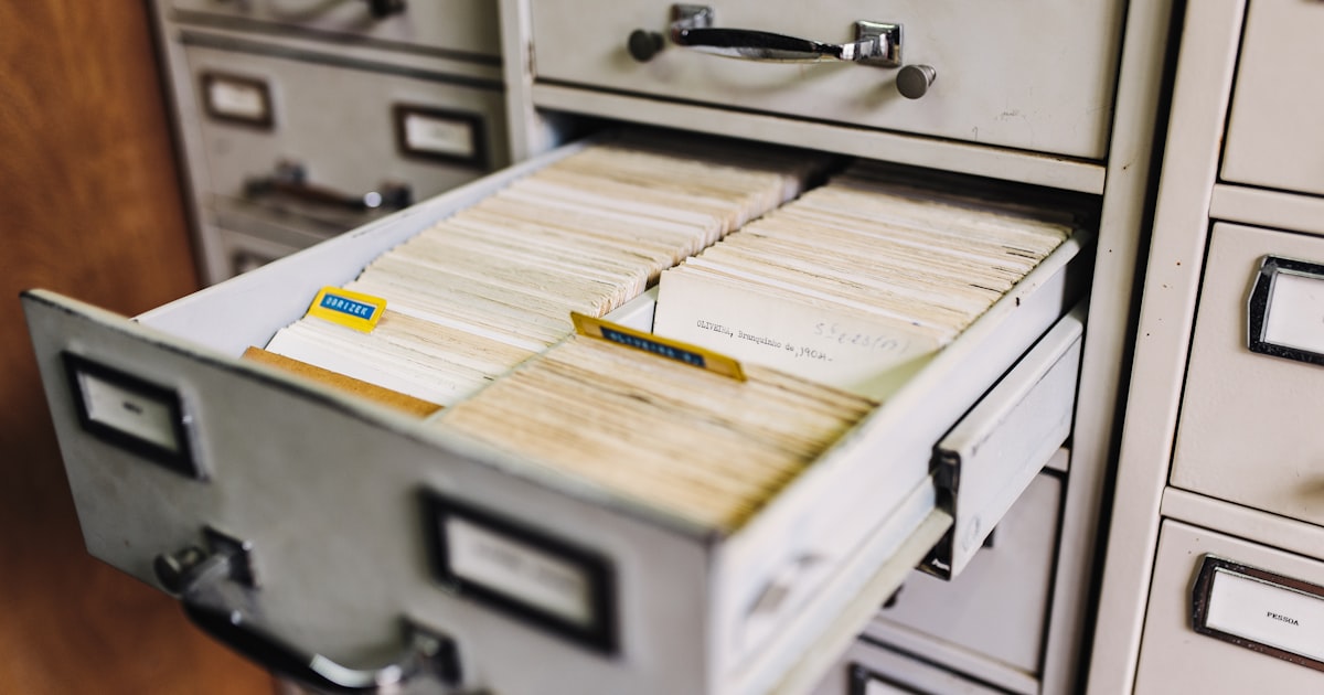 Filing cabinet with organized document folders representing long term email archive storage