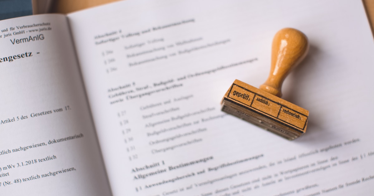 Rubber stamp on legal compliance document representing PHIPA regulatory review of Paubox